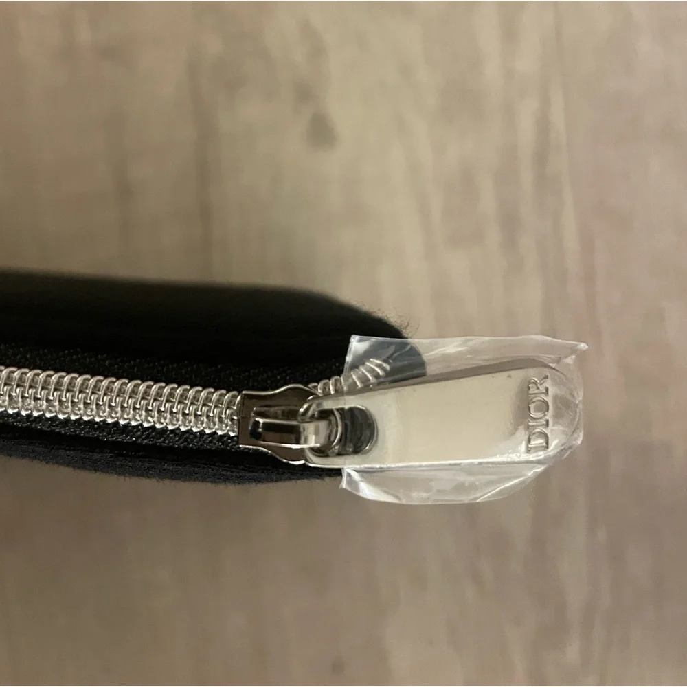 Authentic Dior flat pouch in Black. New. Comes with box.